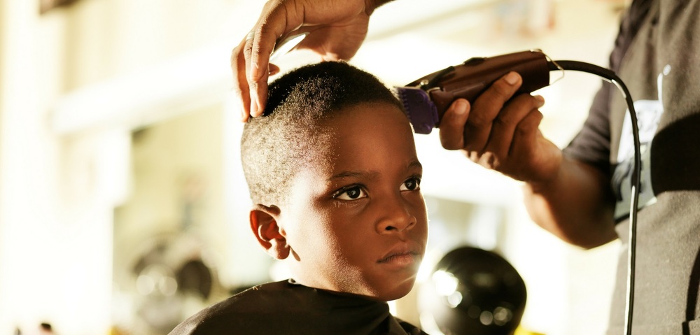 Cosmetology- a little boy getting his hair cut