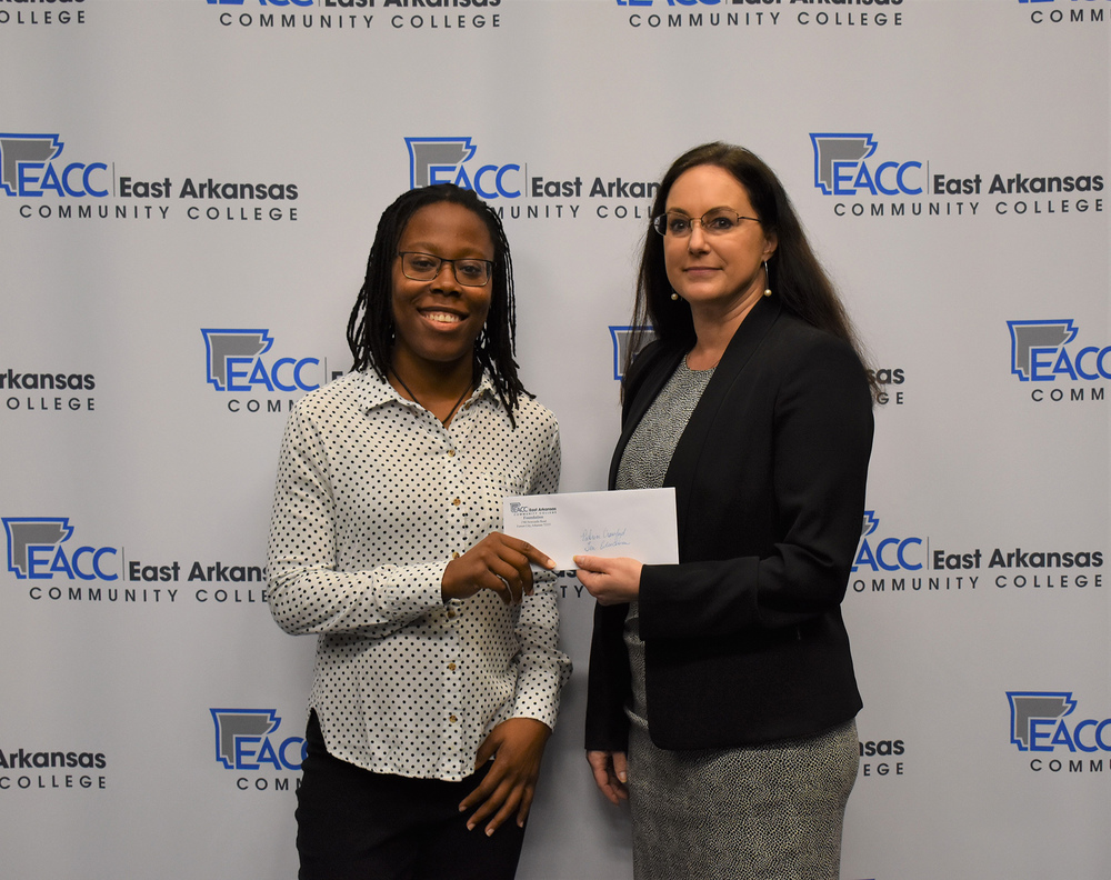 Patrice Crawford receives Foundation's General Education Scholarship award from Dr. Cathie Cline, EACC President