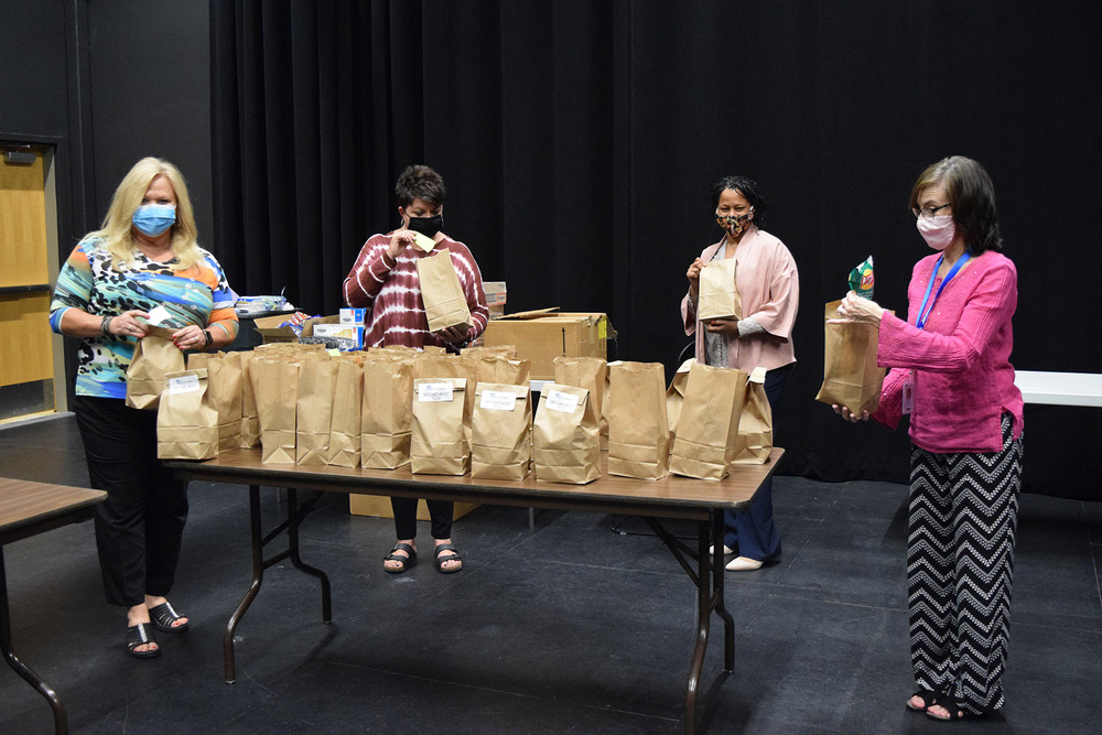 Food Pantry committee pack snack bags for students