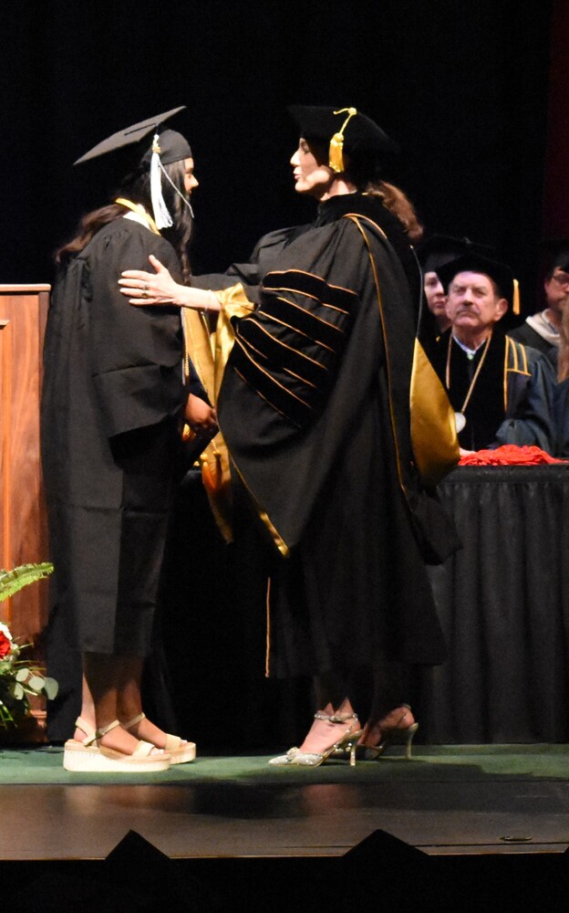 Dr. Cline congratulates PWHS Isabell Carden.JPG